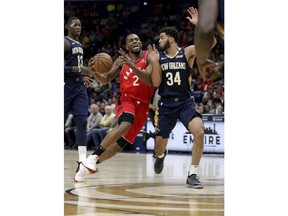 Toronto Raptors forward Kawhi Leonard (2) drives to the basket against New Orleans Pelicans guard Kenrich Williams (34) in the first half of an NBA basketball game in New Orleans, Friday, March 8, 2019.