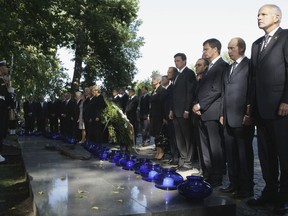 FILE - In this Tuesday, Sept. 1, 2009 file photo, Russian Prime Minister Vladimir Putin, second right, and other European leaders take part in a memorial ceremony at the Cemetery of Defenders of Westerplatte outside Gdansk, northern Poland to mark the 70th anniversary of the beginning of World War II. Polish authorities have refused to invite a Russian delegation to a commemoration ceremony marking the 80th anniversary of the outbreak of World War II. Krzysztof Szczerski, an aide to the Polish president, said on Wednesday March 20, 2019, in comments carried by the Polish news agency PAP that Russia has not been invited to the events in September due to its aggressive actions in Ukraine.