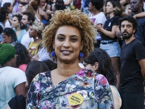In this Jan. 9, 2018 file photo, Rio de Janeiro Councilwoman Marielle Franco smiles for a photo in Cinelandia square.
