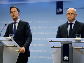 Dutch Prime Minister Mark Rutte, left, and Justice and Security Minister Ferd Grapperhaus speak to the media at a press conference in The Hague, Netherlands, Monday, March 18, 2019. Dutch police are hunting down a suspect after a shooting on a tram in the central Dutch city of Utrecht that left several dead and more wounded. Authorities immediately raised the terror alert for the area to the maximum level. "Our nation was hit by an attack in Utrecht," Dutch Prime Minister Mark Rutte said. He said that "a terror motive is not excluded."