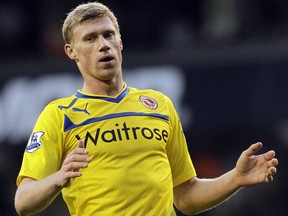 FILE - In this Tuesday, Jan. 1, 2013 file photo, Reading's Pavel Pogrebnyak reacts as he plays against Tottenham Hotspur during their English Premier League soccer match at White Hart Lane, London. Russian striker Pavel Pogrebnyak has on Tuesday, March 26, 2019 been fined for remarks he made about black players on the Russia national team. Pogrebnyak told Russian newspaper Komsomolskaya Pravda this month that he didn't believe Brazil-born Ari should play for Russia, adding "it's funny when a dark-skinned player plays for the Russia team."