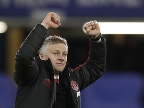 FILE - In this Monday, Feb. 18, 2019 file photo, Manchester United caretaker head coach Ole Gunnar Solskjaer applauds fans at the end of the English FA Cup fifth round soccer match between Chelsea and Manchester United at Stamford Bridge stadium in London. Manchester United on Thursday March 28, 2019, made coach Ole Gunnar Solskjaer a permanent hire, with a three-year contract.