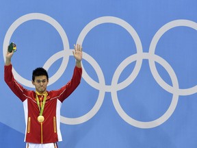 FILE - In this file photo dated Monday, Aug. 8, 2016, China's gold medal winner Sun Yang waves during the medal ceremony for the men's 200-meter freestyle final during the swimming competitions at the 2016 Summer Olympics, in Rio de Janeiro, Brazil.  China's star swimmer Sun Yang risks being banned from the Tokyo Olympics for the alleged destruction of a doping control sample, according to information made available Wednesday March 13, 2019, from the Court of Arbitration for Sport.