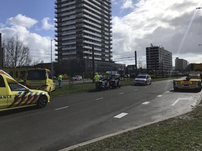Emergency services attend the scene of a shooting in Utrecht, Netherlands, Monday March 18, 2019. Police in the central Dutch city of Utrecht say on Twitter that "multiple" people have been injured as a result of a shooting in a tram in a residential neighborhood.