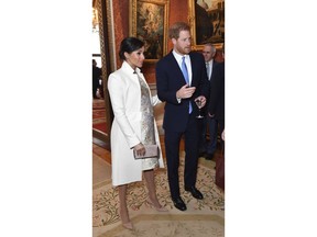 Britain's Prince Harry and Meghan, Duchess of Sussex attend a reception at Buckingham Palace, London, Tuesday March 5, 2019, to mark the fiftieth anniversary of the investiture of the Prince of Wales.