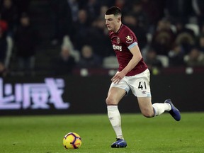 FILE - In this file photo dated Friday, Feb. 22, 2019, West Ham's Declan Rice during the English Premier League soccer match against Fulham at the London Stadium in London.  A day before possibly making his England debut, Declan Rice has apologised for an old social-media post in which he appeared to support the IRA, the Irish republican paramilitary organisation that sought to end British rule in Northern Ireland.
