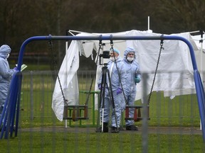 Police forensic officers at the scene in east London Saturday March 2, 2019, following the fatal stabbing of a 17-year-old girl on Friday night.  Two 17-year-olds were stabbed to death last weekend in different parts of England, plunging families into grief and igniting an intense debate published in Britain's news media Tuesday March 5, 2019, about why so many young people are dying, and who is to blame.