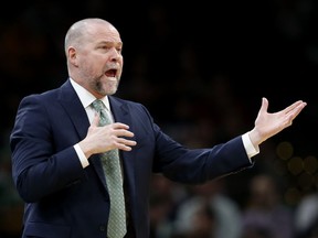 Denver Nuggets head coach Michael Malone calls to his players during the first quarter of an NBA basketball game against the Boston Celtics in Boston, Monday, March 18, 2019.