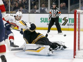 Florida Panthers right wing Evgenii Dadonov (63) scores past Boston Bruins goaltender Tuukka Rask (40) during the first period of an NHL hockey game, Saturday, March 30, 2019, in Boston.