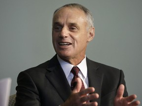 Major League Baseball Commissioner Rob Manfred addresses a gathering of the Boston College Chief Executives Club, Wednesday, March 6, 2019, in Boston.