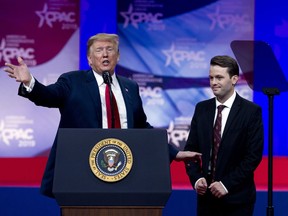 President Donald Trump invites to speak in the podium to Hayden Williams, a field representative of the Leadership Institute, who was assaulted at Berkeley campus speaks at Conservative Political Action Conference, CPAC 2019, in Oxon Hill, Md., Saturday, March 2, 2019.