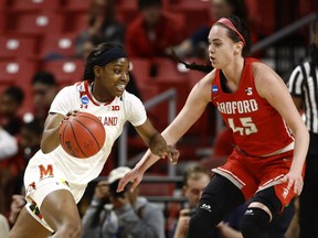 Maryland guard Kaila Charles, left, drives against Radford forward Savannah Felgemacher in the first half of a first round women's college basketball game in the NCAA Tournament, Saturday, March 23, 2019, in College Park, Md.