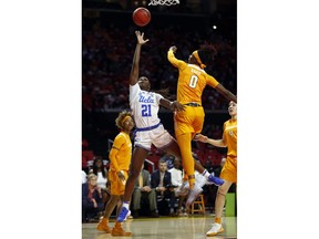 UCLA forward Michaela Onyenwere (21) shoots over Tennessee guard Rennia Davis in the first half of a first-round game in the NCAA women's college basketball tournament, Saturday, March 23, 2019, in College Park, Md.