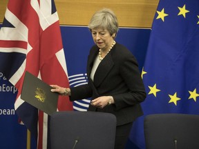 Britain's Prime Minister Theresa May arrives for a media conference after a meeting with European Commission President Jean-Claude Juncker at the European Parliament in Strasbourg, eastern France, Monday, March 11, 2019. Prime Minister Theresa May is making a last-ditch attempt to get concessions from EU counterparts on elements of the agreement they all reached late last year.