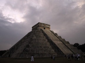 People gather in front of the Kukulkan temple in Chichen Itza, Mexico, early Friday, Dec. 21, 2012.