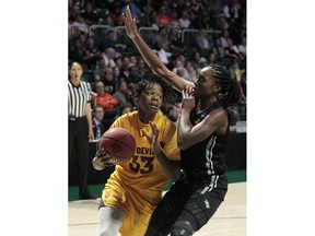 Arizona State center Charnea Johnson-Chapman (33) drives to the basket around UCF forward Masseny Kaba (5), during a first round women's college basketball game in the NCAA Tournament in Friday, March 22, 2019, in Coral Gables, Fla. Arizona State defeated UCF 60-45.
