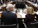 Privy Council Clerk Michael Wernick, left, speaks with Deputy Minister of Justice Nathalie Drouin before testifying at the House of Commons justice committee on March 6, 2019.