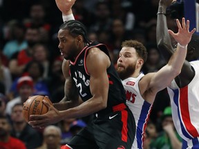 Toronto Raptors forward Kawhi Leonard (2) looks to pass as Detroit Pistons forward Blake Griffin defends during the second half of an NBA basketball game, Sunday, March 17, 2019, in Detroit.