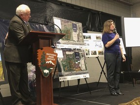 Toni Cooper, right, executive director of the River Raisin National Battlefield Park Foundation, reveals the upcoming plans for development of the River Raisin National Battlefield Park,as part of the Heritage Corridor investment as Chief Ted Roll, left, of the Wyandot of Anderdon Nation listens March 21, 2019 in Monroe, Mich.