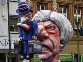 A carnival float depicts British Prime Minister Theresa May and the Brexit prior to the traditional carnival parade in Duesseldorf, Germany, on Monday, March 4, 2019. The foolish street spectacles in the carnival centers of Duesseldorf, Mainz and Cologne, watched by hundreds of thousands of people, are the highlights in Germany's carnival season on Rosemonday.