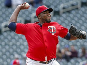 Minnesota Twins' Michael Pineda throws to the Cleveland Indians in the first inning of a baseball game Sunday, March 31, 2019, in Minneapolis.