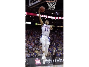 Kansas' Devon Dotson shoots during the first half of an NCAA college basketball game against Texas in the Big 12 men's tournament Thursday, March 14, 2019, in Kansas City, Mo.