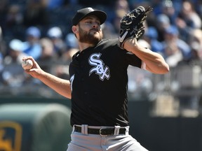 Chicago White Sox starting pitcher Lucas Giolito throws in the first inning of a baseball game against the Kansas City Royals, Sunday, March 31, 2019, in Kansas City, Mo.