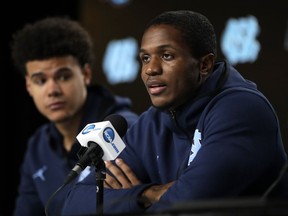 North Carolina's Kenny Williams, right, answers a question as teammate Cameron Johnson listens during a news conference at the NCAA men's college basketball tournament Thursday, March 28, 2019, in Kansas City, Mo. North Carolina plays Auburn in a Midwest Regional semifinal on Friday.