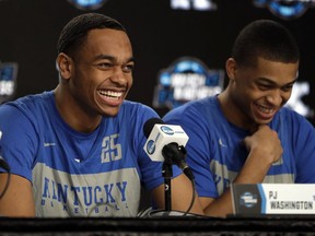 Kentucky's PJ Washington, left, laughs along with his teammate Keldon Johnson during a news conference at the NCAA men's college basketball tournament Thursday, March 28, 2019, in Kansas City, Mo. Kentucky plays Houston in a Midwest Regional semifinal on Friday.
