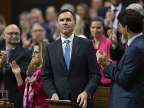 Prime Minister Justin Trudeau and MPs applaud as Finance Minister Bill Morneau rises to deliver the federal budget in the House of Commons in Ottawa, Tuesday March 19, 2019.