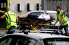 Ambulance staff take a man from outside a mosque in central Christchurch, New Zealand, March 15, 2019.