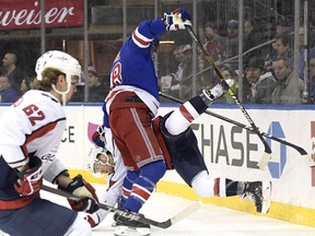 New York Rangers defenseman Marc Staal (18) checks Washington Capitals defenseman Nick Jensen during the first period of an NHL hockey game Sunday, March 3, 2019, at Madison Square Garden in New York.