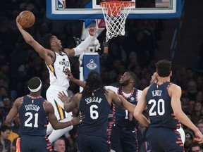 Utah Jazz guard Donovan Mitchell (45) dunks during the first half of the team's NBA basketball game against the New York Knicks, Wednesday, March 20, 2019, at Madison Square Garden in New York.