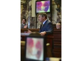 FILE - In this Feb. 13, 2019 file photo, images of fetuses scroll across monitors in the Senate chamber, as Sen. Joey Fillingane, R-Sumrall, answers questions during a debate over a six-week abortion ban bill. On Tuesday, March 19, 2019, Mississippi senators passed the final version of a bill that would ban most abortions once a fetal heartbeat can be detected, about six weeks into pregnancy.