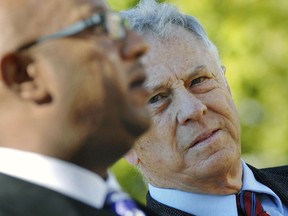 FILE - In this Tuesday, Sept. 6, 2011, file photo, Morris Dees with the Southern Poverty Law Center, right, listens during a news conference, at the Hinds County Courthouse in Jackson, Miss. The Alabama-based Southern Poverty Law Center, a nationally known nonprofit that monitors hate organizations, said Thursday, March 14, 2019, it had fired co-founder Morris Dees, who once won a lawsuit that bankrupted a leading Ku Klux Klan group.