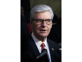 FILE - In this Jan. 20, 2019 file photograph, Gov. Phil Bryant explains to reporters the advantages of passing and signing the Mississippi Broadband Enabling Act, at the Capitol in Jackson, Miss. Mississippi's white Republican governor Bryant and U.S. Rep. Bennie Thompson, the state's only black Democratic congressman are feuding over who should get credit for the home of a slain civil rights leader becoming a national monument. Thompson says he has worked on the issue for 16 years.