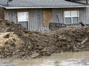 This March 11, 2019 photo shows a makeshift levee built by a resident in Rolling Fork, Miss., to protect his home from flood waters. In March 2019, scientists are warning that historic flooding could soon deluge parts of several southern states along the lower Mississippi River, where flood waters could persist for several weeks.