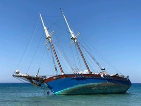 Cuban authorities have backed off a threat to seize the last surviving St. Lawrence River schooner, which ran aground on a beach in the Caribbean country on Jan. 27. But the danger remains very real for the Grosse-Ile, shown in a handout photo, an important piece of the province's maritime heritage. THE CANADIAN PRESS/HO-Facebook-Didier Epars MANDATORY CREDIT