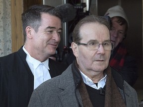 Glen Assoun, right, arrives at Nova Scotia Supreme Court with his lawyer Sean MacDonald in Halifax on Friday, March 1, 2019.
