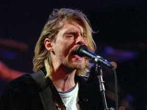This Dec. 13, 1993 file photo shows Kurt Cobain of the Seattle band Nirvana performing in Seattle, Wash.