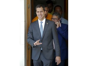 National Assembly President Juan Guaido, who declared himself interim president of Venezuela, arrives to lead a session of the opposition-controlled assembly in Caracas, Venezuela, Monday, March 11, 2019. An explosion rocked a power station Monday in the Venezuelan capital, witnesses said, adding to the crisis created by days of nationwide power cuts, while Guaido has blamed the blackouts that began Thursday on alleged government corruption and mismanagement.