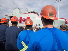 Shipbuilders attend the naming ceremony for Canada's lead Arctic and Offshore Patrol Ship, the future HMCS Harry DeWolf, in Halifax on Oct. 5, 2018.