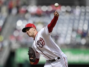 Washington Nationals starting pitcher Patrick Corbin delivers during the first inning of a baseball game against the New York Mets, Sunday, March 31, 2019, in Washington.