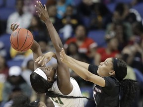 South Carolina's Victaria Saxton (5) knocks the ball from Baylor's Kalani Brown (21) during the first half of a regional women's college basketball game in the NCAA Tournament in Greensboro, N.C., Saturday, March 30, 2019.