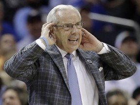 North Carolina head coach Roy Williams reacts to a call during the second half of an NCAA college basketball game against Louisville in the Atlantic Coast Conference tournament in Charlotte, N.C., Thursday, March 14, 2019.