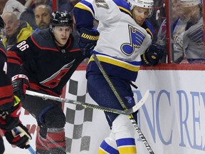 Carolina Hurricanes' Teuvo Teravainen (86), of Finland, chases the puck with St. Louis Blues' Jaden Schwartz (17) during the first period of an NHL hockey game in Raleigh, N.C., Friday, March 1, 2019.