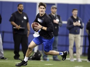 Quarterback Daniel Jones rolls out to pass during Duke's football Pro Day in Durham, N.C., Tuesday, March 26, 2019.