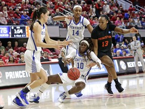 Kentucky's Maci Morris, left, Tatyana Wyatt (14) and Rhyne Howard (10) chase the ball with Princeton's Sydney Jordan (13) during the second half of a first-round game in the NCAA women's college basketball tournament in Raleigh, N.C., Saturday, March 23, 2019. Kentucky won 82-77.