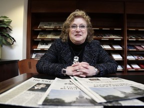 Penelope Muse Abernathy, a University of North Carolina professor, stands with the daily newspaper selection in the Park Library at the School of Journalism in Chapel Hill, N.C., on Thursday, March 7, 2019. "Strong newspapers have been good for democracy, and both educators and informers of a citizenry and its governing officials. They have been problem-solvers," said Abernathy, who studies news industry trends and oversaw the "news desert" report released the previous fall.
