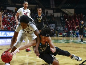 South Carolina guard Doniyah Cliney, left, and Florida State guard Nausla Woolfolk, right, battle for the ball during the first half of a second-round women's college basketball game in the NCAA Tournament in Charlotte, N.C., Sunday, March 24, 2019.